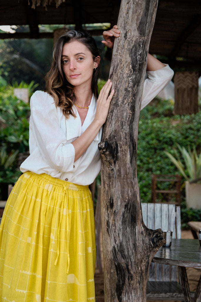 This Lemon Sorbet Skirt is made in collaboration between Erica Kim @ahistoryofarchitecture and World of Crow, it has a yellow color, checks detailing, jamdani fabric, ankle length skirt
