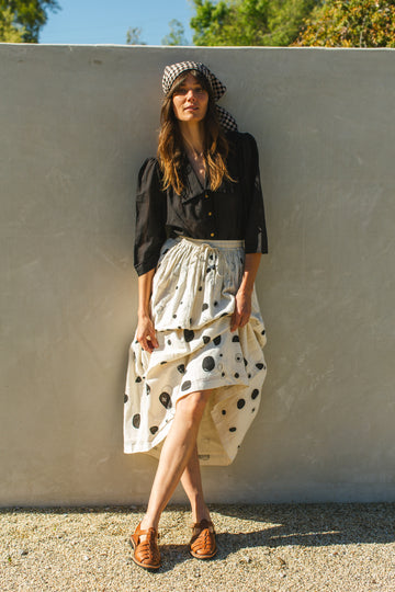 This Raindrops skirt is made in collaboration between Erica Kim and World of Crow, hand patch worked, Black and white color, midi length, sustainably made