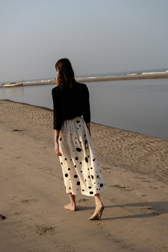This Raindrops skirt is made in collaboration between Erica Kim and World of Crow, hand patch worked, Black and white color, midi length, sustainably made