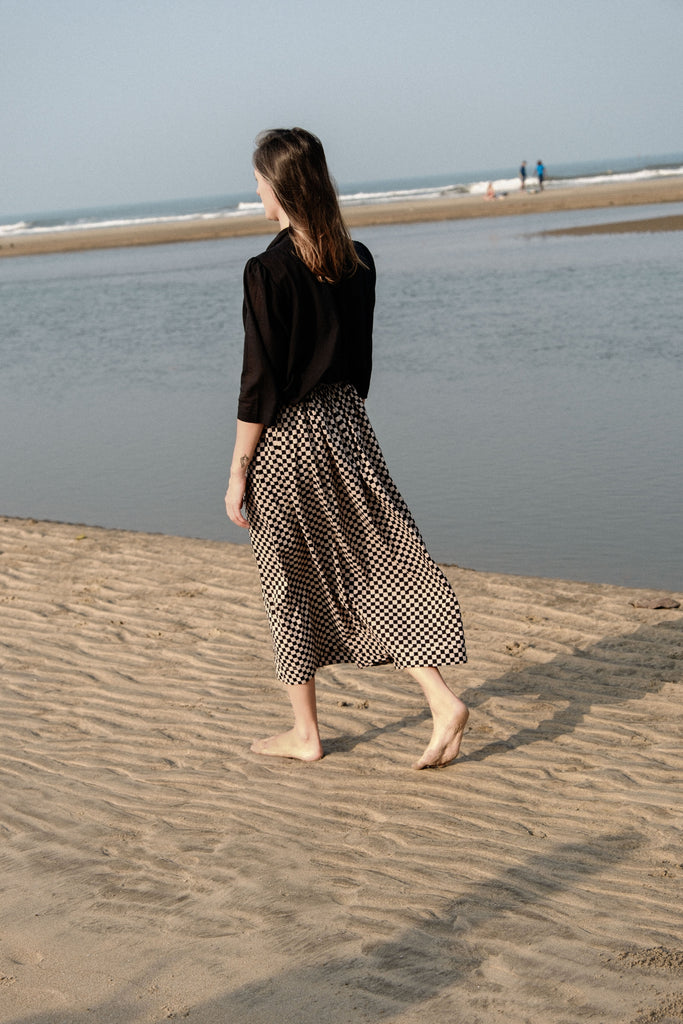 Checkered block printed, black and white skirt, ankle length, this skirt is made in collaboration between Erica Kim and World of Crow, smocked elasticated waist, sustainably made