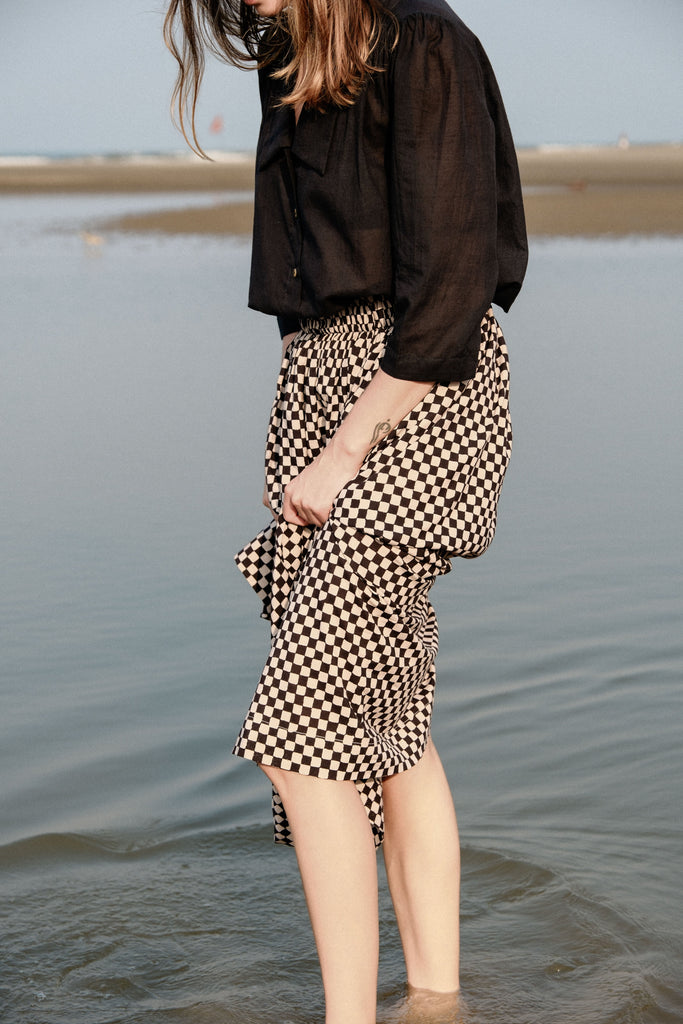 Checkered block printed, black and white skirt, ankle length, this skirt is made in collaboration between Erica Kim and World of Crow, smocked elasticated waist, sustainably made