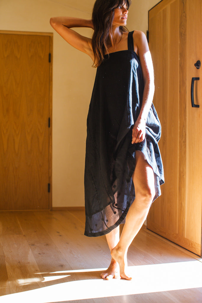 This Everywhere dress is made in collaboration between Erica Kim and World of Crow, it's sleeveless, black in color, Jamdani fabric, Midi length, Sustainably made