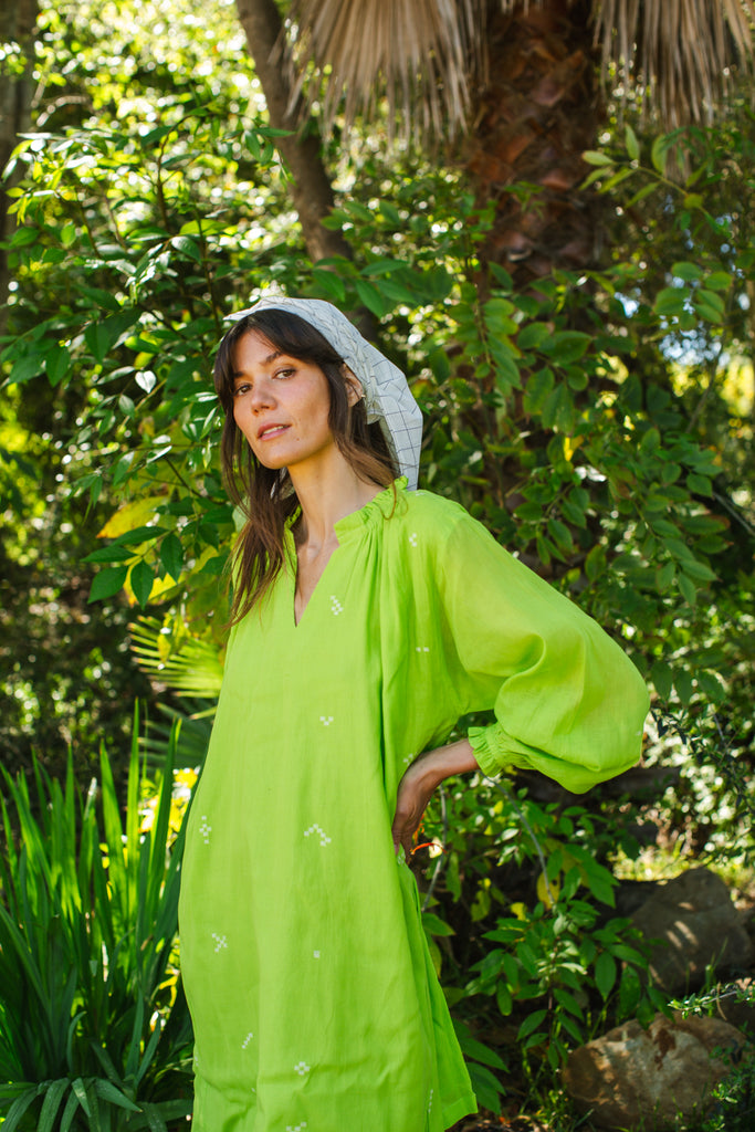 This Pride of Crow mini dress is made in collaboration between Erica Kim and World of Crow, it has a frilled round V-neckline, Sorbet green colour, A-line flare, Drop shoulders, Long gathered cuff sleeves, side pockets, Oversized fit in Jamdani fabric