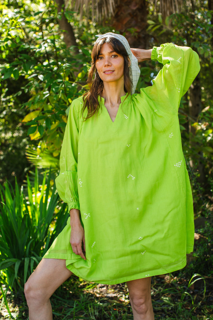 This Pride of Crow mini dress is made in collaboration between Erica Kim and World of Crow, it has a frilled round V-neckline, Sorbet green colour, A-line flare, Drop shoulders, Long gathered cuff sleeves, side pockets, Oversized fit in Jamdani fabric