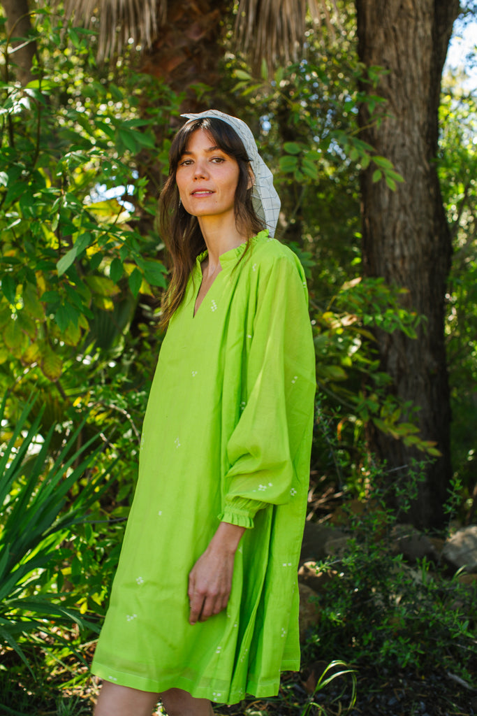 This Pride of Crow mini dress is made in collaboration between Erica Kim and World of Crow, it has a frilled round V-neckline, Sorbet green colour, A-line flare, Drop shoulders, Long gathered cuff sleeves, side pockets, Oversized fit in Jamdani fabric