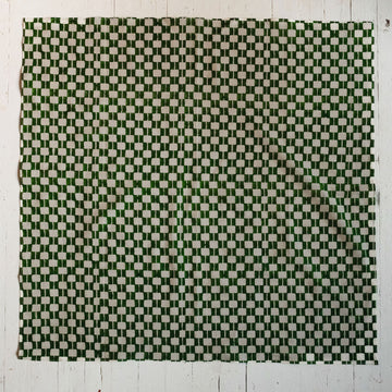 Handwoven green and white checkered cotton bandana by World of Crow, ethically crafted in India using traditional weaving techniques – sustainable and artisanal accessory for conscious fashion lovers