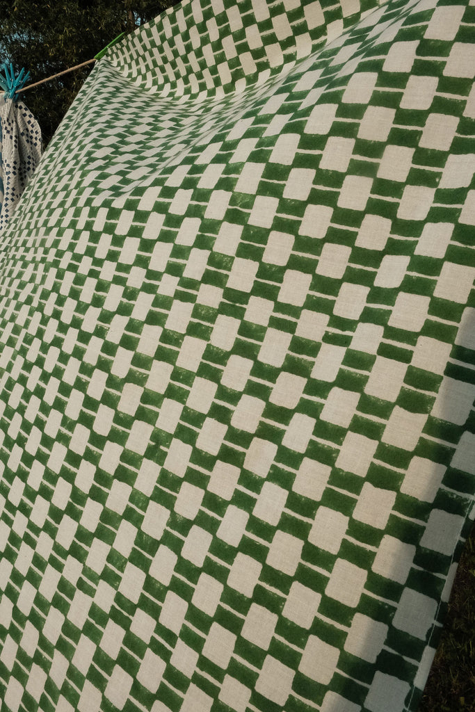 Handwoven green and white checkered cotton bandana by World of Crow, ethically crafted in India using traditional weaving techniques – sustainable and artisanal accessory for conscious fashion lovers