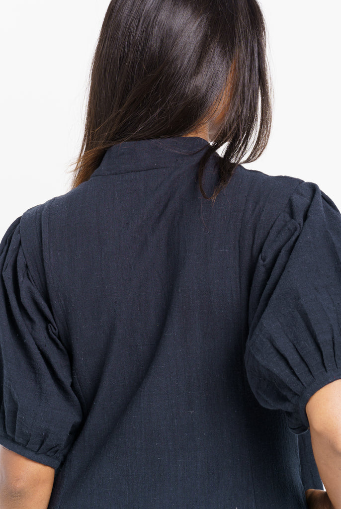 A classic ink black midi dress, best eco friendly fashion brands, best ethical clothing companies, thought organic clothing, wholesale organic clothing made in India, affordable organic cotton clothing, all natural clothing, quality women's clothing, quality women's clothing stores, women's minimalist wardrobe, closet essentials minimalist