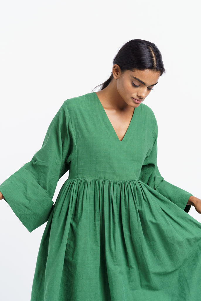Basil green gathered midi dress, ethical and sustainable clothing, ethical clothing brands, organic cotton retailers, organic cotton shop, cotton clothing company, natural cotton clothing, India women's clothing, India women's clothing stores, create a minimalist closet, dark minimalist fashion