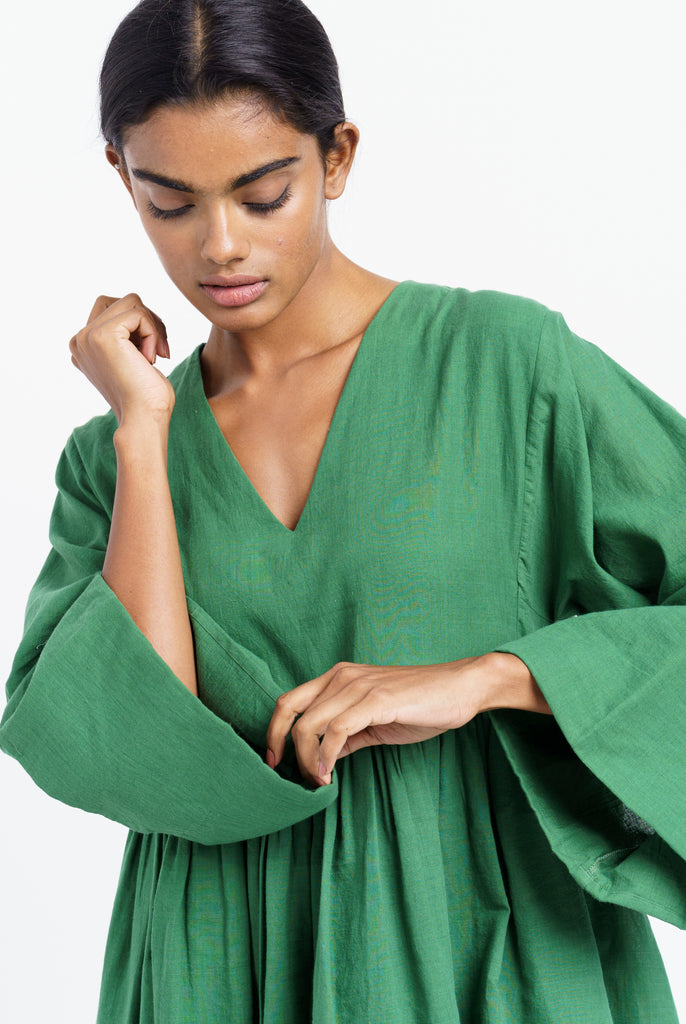 Basil green gathered midi dress, ethical and sustainable clothing, ethical clothing brands, organic cotton retailers, organic cotton shop, cotton clothing company, natural cotton clothing, India women's clothing, India women's clothing stores, create a minimalist closet, dark minimalist fashion