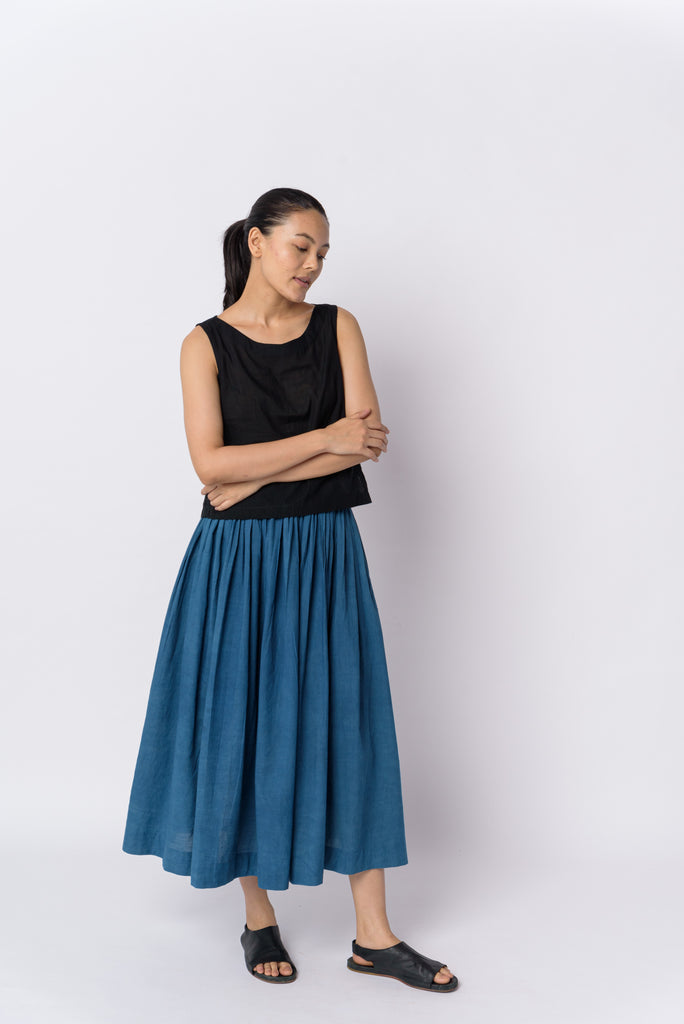Indigo pleated skirt, best sustainable fashion brands, clothing companies that are sustainable, organic cotton women's clothing, 100 organic cotton clothing, cotton cotton clothing, all cotton clothes, all cotton women's clothing, women's cotton clothing online, the minimal clothing, minimal clothes shop