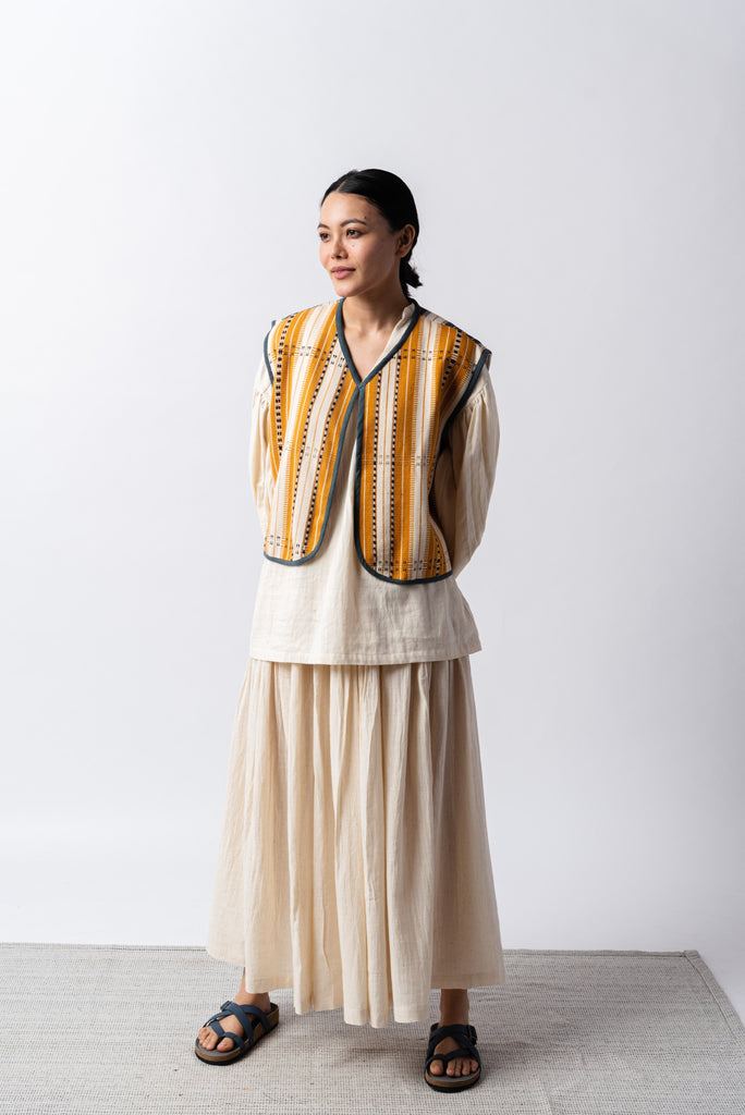 Open front mustard striped short gilet, environmentally sustainable clothing brands, ethical clothing sites, organic cotton shirts India, organic dresses India, natural clothing line, natural fabric clothing, all cotton women's clothing, women's cotton clothing online, perfect minimalist wardrobe, structured clothing brands