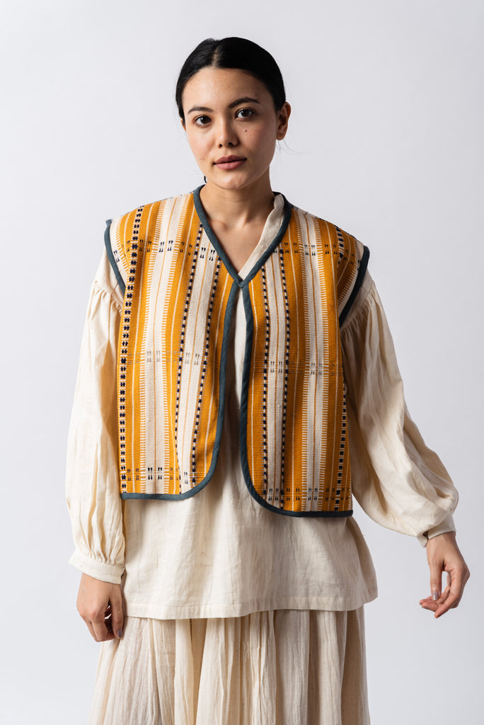 Open front mustard striped short gilet, environmentally sustainable clothing brands, ethical clothing sites, organic cotton shirts India, organic dresses India, natural clothing line, natural fabric clothing, all cotton women's clothing, women's cotton clothing online, perfect minimalist wardrobe, structured clothing brands