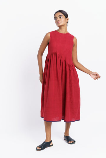 Red pleated midi dress, responsible clothing brands, sustainable India clothing brands, India made organic clothing, best organic and sustainable clothing brands, cotton clothing store near me, lightweight cotton women's clothing, cotton on women's pants, earthy women's clothes, minimalist clothing list women's, minimalist dress