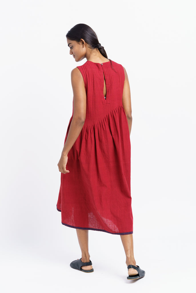 Red pleated midi dress, responsible clothing brands, sustainable India clothing brands, India made organic clothing, best organic and sustainable clothing brands, cotton clothing store near me, lightweight cotton women's clothing, cotton on women's pants, earthy women's clothes, minimalist clothing list women's, minimalist dress