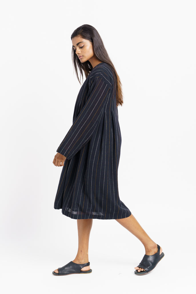 Striped relaxed fit midi dress, sustainable wear, top 10 sustainable clothing brands, organic cotton online, organic cotton dress, clothing brands with natural fibers, cotton and company clothing, ethically made women's clothing, ever lane women's dresses, minimalist wardrobe guide, minimalist wholesale clothing