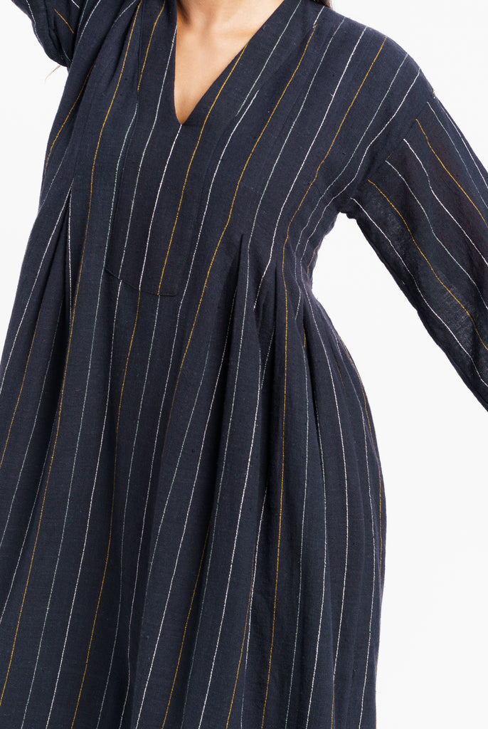 Striped relaxed fit midi dress, sustainable wear, top 10 sustainable clothing brands, organic cotton online, organic cotton dress, clothing brands with natural fibers, cotton and company clothing, ethically made women's clothing, ever lane women's dresses, minimalist wardrobe guide, minimalist wholesale clothing