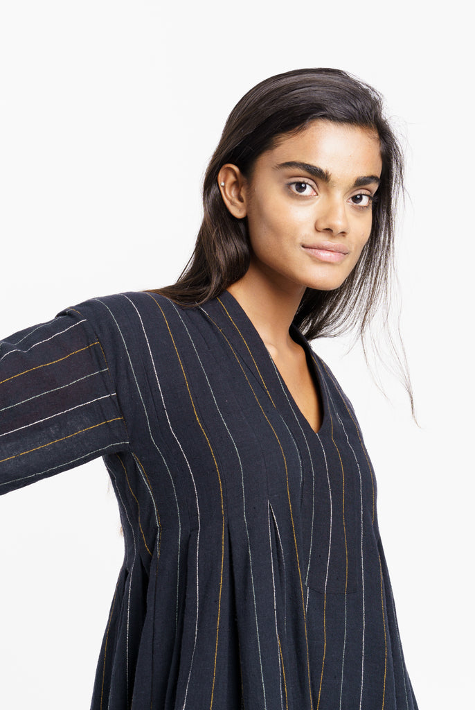 Striped relaxed fit midi dress, sustainable wear, top 10 sustainable clothing brands, organic cotton online, organic cotton dress, clothing brands with natural fibers, cotton and company clothing, ethically made women's clothing, ever lane women's dresses, minimalist wardrobe guide, minimalist wholesale clothing