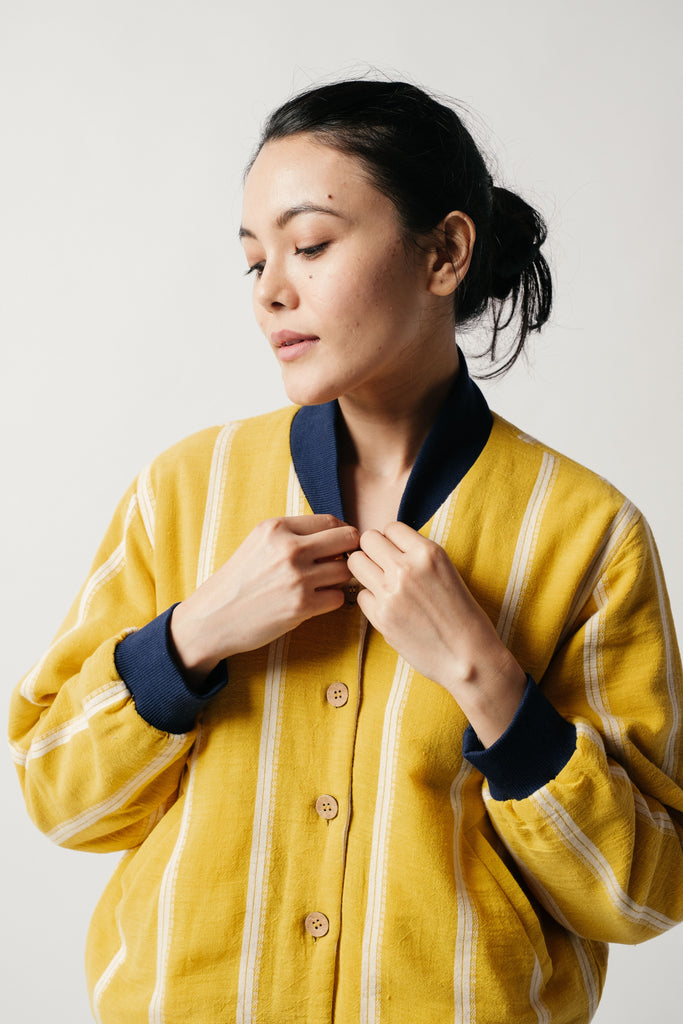 Yellow striped/textured reversible bomber jacket, eco fair trade clothing, environmental clothing, certified organic clothing, organic apparel, affordable feminine clothing, affordable hemp clothing, high quality women's dresses, loose fitting women's clothing, aesthetic wear shop, aesthetic women's clothing